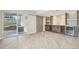 Finished basement with a custom bar area, walkout access and wood-look floors at 16226 W 94Th Dr, Arvada, CO 80007