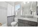 Well-lit bathroom with a shower-tub combination and granite countertop vanity at 16226 W 94Th Dr, Arvada, CO 80007