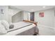Basement bedroom featuring carpet, a comfortable bed, and warm lighting at 16226 W 94Th Dr, Arvada, CO 80007