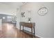 Charming entryway featuring hardwood floors and a decorative console table at 16226 W 94Th Dr, Arvada, CO 80007