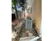 A quaint backyard features a pathway, shed, landscaping, and air conditioner unit at 14503 E Wagon Trail Dr, Aurora, CO 80015