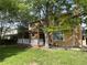 Large, lush backyard with mature trees, and a patio at 14503 E Wagon Trail Dr, Aurora, CO 80015