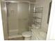 A bathroom offers a shower with sliding doors, a toilet, and a vanity with plenty of storage at 14503 E Wagon Trail Dr, Aurora, CO 80015