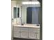 Bathroom with dual sinks and ample cabinet space at 14503 E Wagon Trail Dr, Aurora, CO 80015