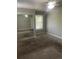 Bedroom featuring carpet, neutral walls, a ceiling fan and a mirrored closet, with a window to the side at 14503 E Wagon Trail Dr, Aurora, CO 80015