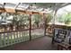 Covered wooden deck with wooden railing overlooks the backyard at 14503 E Wagon Trail Dr, Aurora, CO 80015