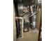 Mechanical room with Goodman furnace, water heater, and related equipment at 14503 E Wagon Trail Dr, Aurora, CO 80015