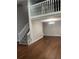 Sun-filled living room features hardwood floors and a staircase at 14503 E Wagon Trail Dr, Aurora, CO 80015