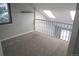 Neutral loft space with skylights and carpeted floors at 14503 E Wagon Trail Dr, Aurora, CO 80015