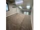 Open loft area with neutral carpet and plenty of natural light from skylights at 14503 E Wagon Trail Dr, Aurora, CO 80015