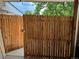 Backyard with a tall wood fence and an open gate at 2201 Lima St, Aurora, CO 80010