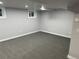 Spacious basement with new carpet, base trim and windows at 2201 Lima St, Aurora, CO 80010