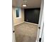 Finished basement featuring plush carpeting, natural light from window well, and clean, modern design at 2201 Lima St, Aurora, CO 80010