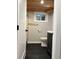 Bathroom featuring a wood ceiling, vanity, and tiled shower at 2201 Lima St, Aurora, CO 80010