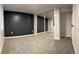 Bedroom with a window, plush carpeting, and sliding mirror closet doors at 2201 Lima St, Aurora, CO 80010