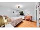 Bright bedroom featuring hardwood floors, a comfortable bed, and abundant natural light at 2201 Lima St, Aurora, CO 80010