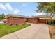 Lovely brick home with a cozy carport, perfect for protecting your vehicle from the elements at 2201 Lima St, Aurora, CO 80010