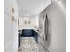 Modern kitchen boasting sleek white cabinets, navy blue lower cabinets, and stylish patterned floors at 2201 Lima St, Aurora, CO 80010