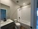 Bathroom featuring white subway tile in shower, white vanity, and modern fixtures at 9476 Yampa Ct, Commerce City, CO 80022