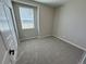 Bedroom with neutral carpet, large window and neutral paint throughout at 9476 Yampa Ct, Commerce City, CO 80022