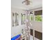 View of modern chandelier, high ceilings, and large windows in the living room at 15079 E Poundstone Pl, Aurora, CO 80015