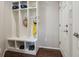 Practical mud room featuring custom built-ins, ample storage, and hooks for organizing at 15079 E Poundstone Pl, Aurora, CO 80015