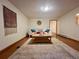 Finished basement area with wood floors, a comfortable sofa and a neutral rug, creating a relaxing atmosphere at 3240 Folsom St, Boulder, CO 80304