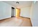 Bedroom featuring light wood floors, a closet, a door, and natural lighting at 3240 Folsom St, Boulder, CO 80304