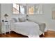 Well-lit bedroom featuring a comfortable bed, a bedside table, and windows offering natural light at 3240 Folsom St, Boulder, CO 80304