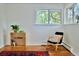 Cozy bedroom nook with hardwood floors, a chair, and a shelving unit, creating a relaxing atmosphere at 3240 Folsom St, Boulder, CO 80304