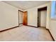 Bedroom showcasing tile floor, a door leading to a closet or another room, and neutral walls at 3240 Folsom St, Boulder, CO 80304