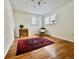 Bedroom nook featuring hardwood floors, a chair, and a shelving unit, creating a relaxing atmosphere at 3240 Folsom St, Boulder, CO 80304