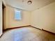 Bedroom featuring tile floor, a window, and neutral-colored walls at 3240 Folsom St, Boulder, CO 80304