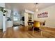 Dining area featuring hard wood floors, a wood table with four yellow chairs at 3240 Folsom St, Boulder, CO 80304