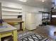 Functional garage space with shelving, workspace, and a large rug at 3240 Folsom St, Boulder, CO 80304