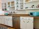 Well-lit kitchen with updated stainless steel appliances, white cabinets and warm wood countertops at 3240 Folsom St, Boulder, CO 80304