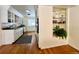 Clean kitchen featuring white cabinets, long countertops, a black and white rug, and stainless appliances at 3240 Folsom St, Boulder, CO 80304