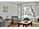 Inviting living room with cozy armchairs, large window, and natural light at 3240 Folsom St, Boulder, CO 80304