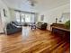 Spacious living room with hardwood floors, large window, comfortable seating, and a piano at 3240 Folsom St, Boulder, CO 80304