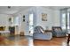 Bright living room featuring hardwood floors, a cozy seating area, and access to the front entrance at 3240 Folsom St, Boulder, CO 80304