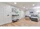 Finished basement with a gray sofa and accent furniture on wood floors at 1724 W 40Th Ave, Denver, CO 80211