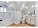 Modern bathroom featuring a walk-in shower with glass door and a vanity with a white countertop at 1724 W 40Th Ave, Denver, CO 80211