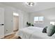 Bedroom with wood floors, sliding door closet and ceiling fan at 1724 W 40Th Ave, Denver, CO 80211
