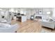 Spacious open-concept living area with a large kitchen island and modern furniture at 1724 W 40Th Ave, Denver, CO 80211