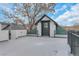 A private rooftop deck with black metal railing and entrance to top floor living at 1724 W 40Th Ave, Denver, CO 80211