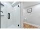 Shower with frameless glass door and white tile at 1724 W 40Th Ave, Denver, CO 80211