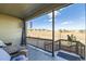 Relaxing covered patio with furniture overlooking the neighborhood landscape at 4051 Happy Hollow Dr, Castle Rock, CO 80104