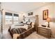 Comfortable bedroom showcasing a large bed, decorative artwork, and soft natural light at 4051 Happy Hollow Dr, Castle Rock, CO 80104
