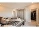 Cozy bedroom with carpet floors, large wardrobe and door to walk in closet at 4051 Happy Hollow Dr, Castle Rock, CO 80104
