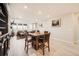 Open-concept living space with dining table, seamlessly connecting to the living room at 4051 Happy Hollow Dr, Castle Rock, CO 80104